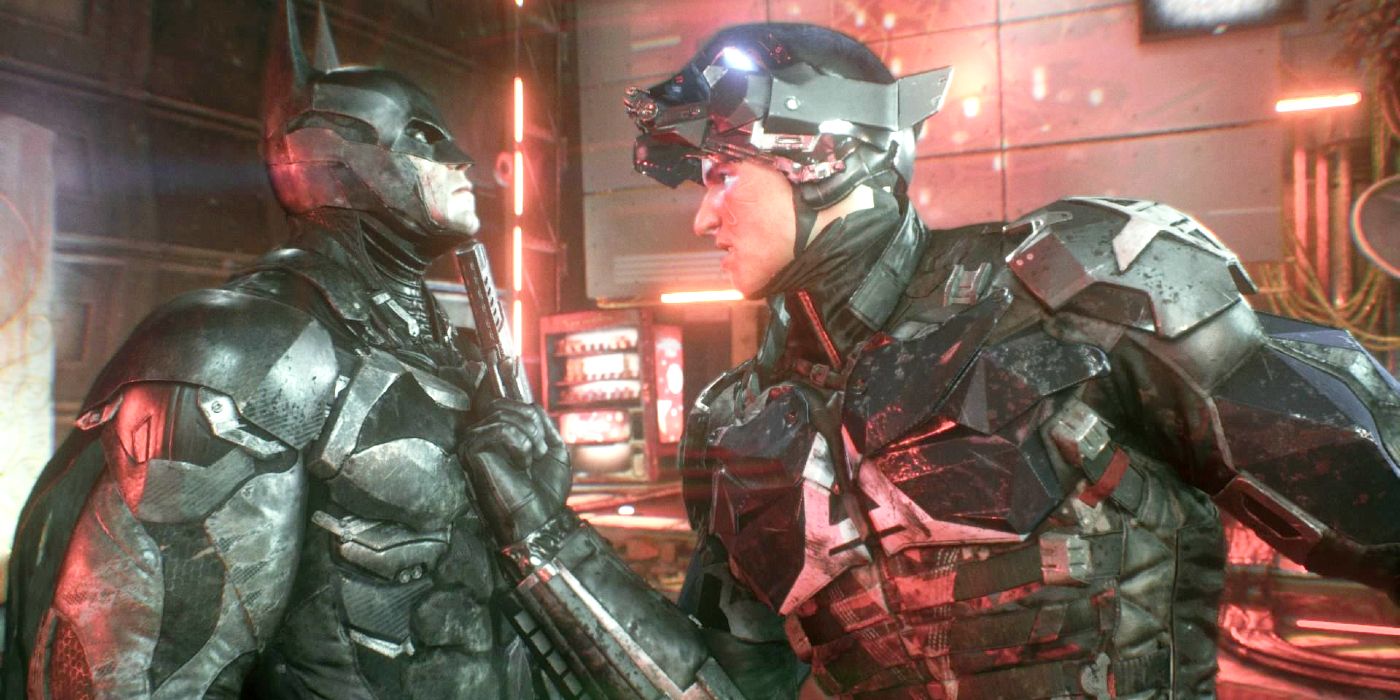 Image de Jason Todd en tant que chevalier d'Arkham face à Batman.  Avec son casque relevé, Jason tient une arme de poing sur le menton de Batman.