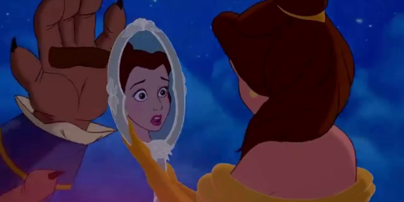Belle looks at the mirror in Beauty and the Beast