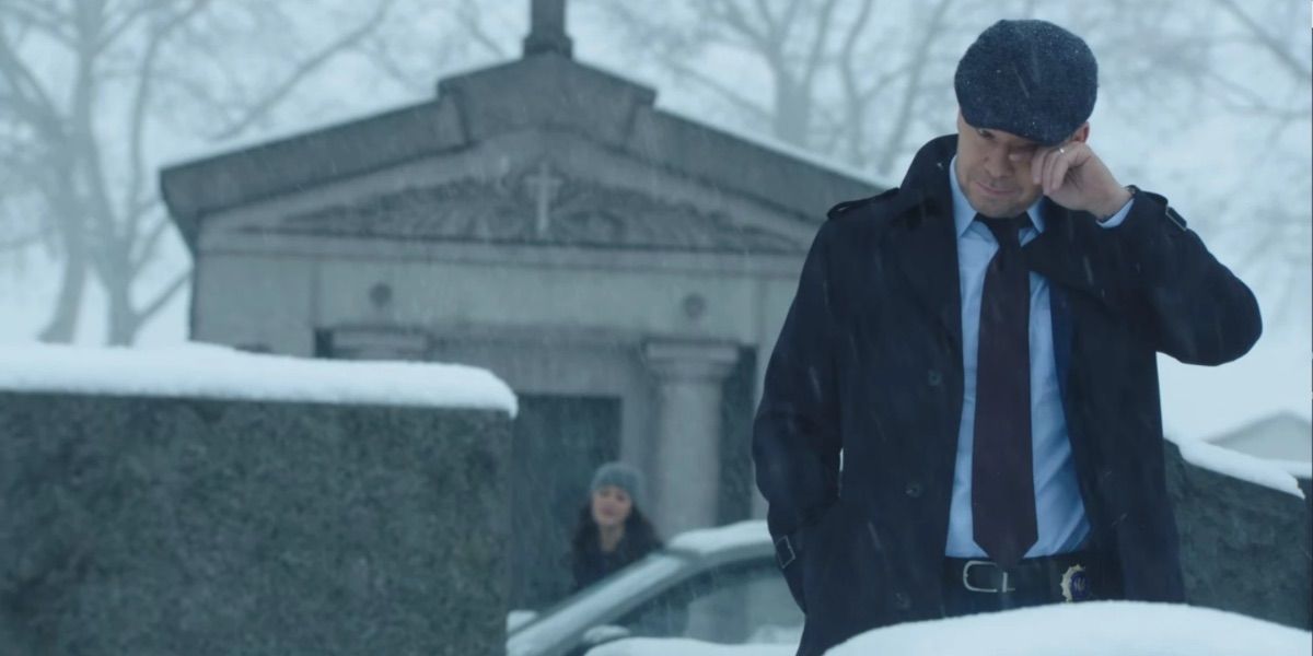 Danny cries at a grave in Blue Bloods 