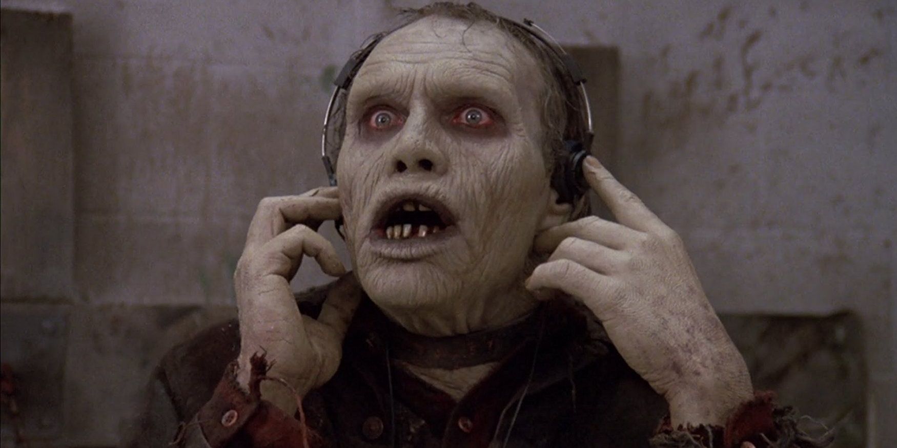 Bub listens excitedly to music on headphones in Day of the Dead