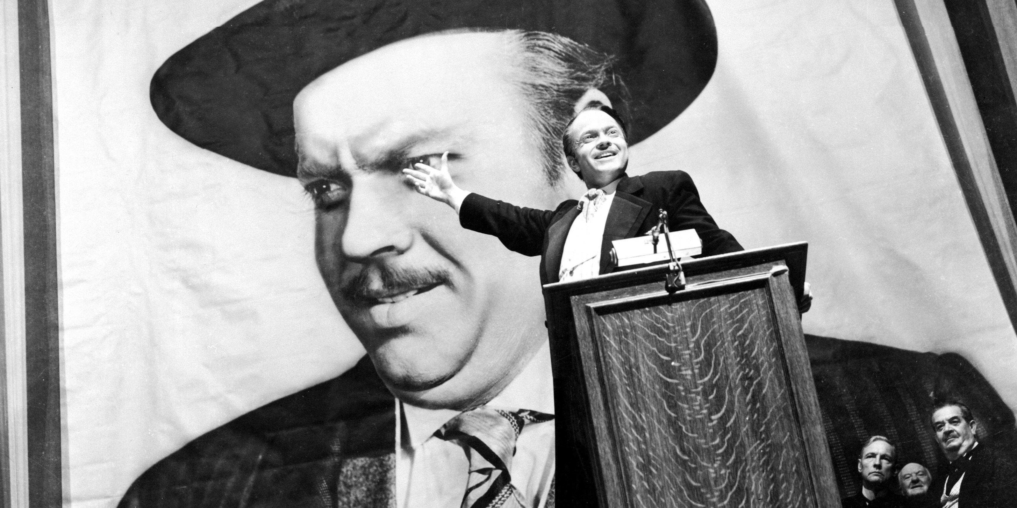 Charles Foster Kane in front of a portrait of himself in Citizen Kane