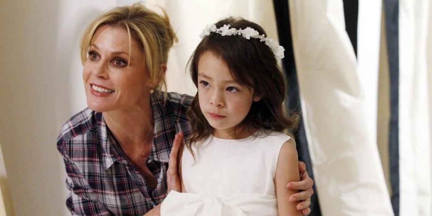 Claire helps Lily with her dress on Modern Family