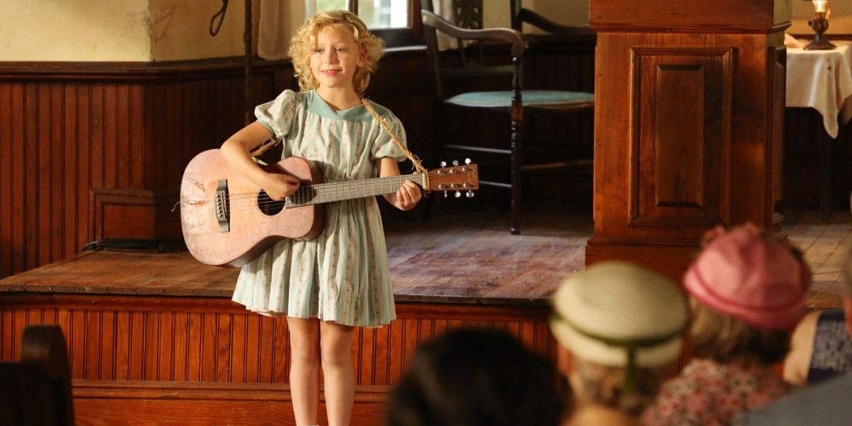 A young Dolly Parton performs in front of a church group from Coat of Many Colors