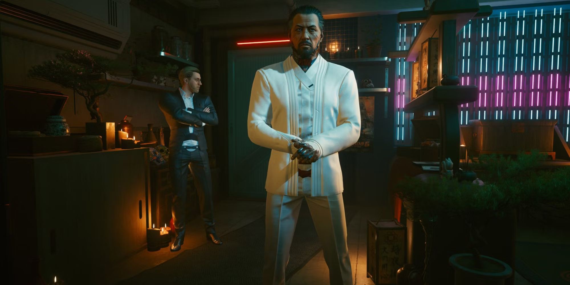 Cyberpunk 2077's Goro Takemura stands in a candlelit room with neon lights.