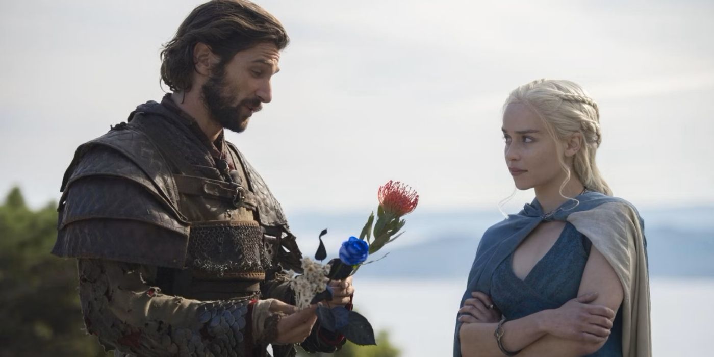 Daario offering Daenerys flowers in Game of Thrones.