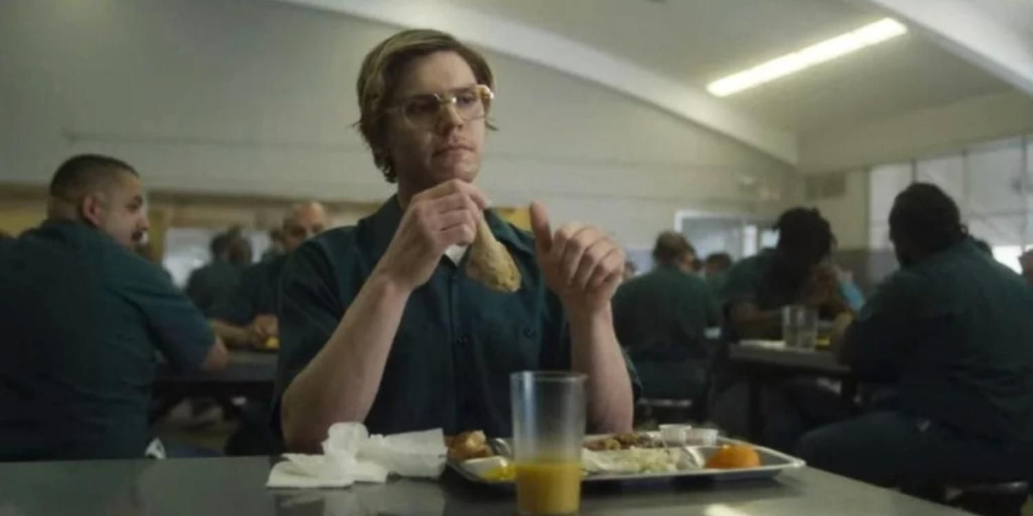 Dahmer eating at a table in prison