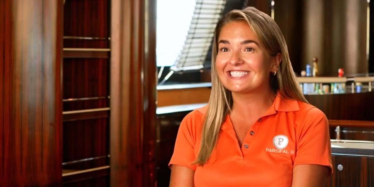 Daisy Kelliher in a confessional moment for Below Deck Sailing Yacht wearing an orange shirt