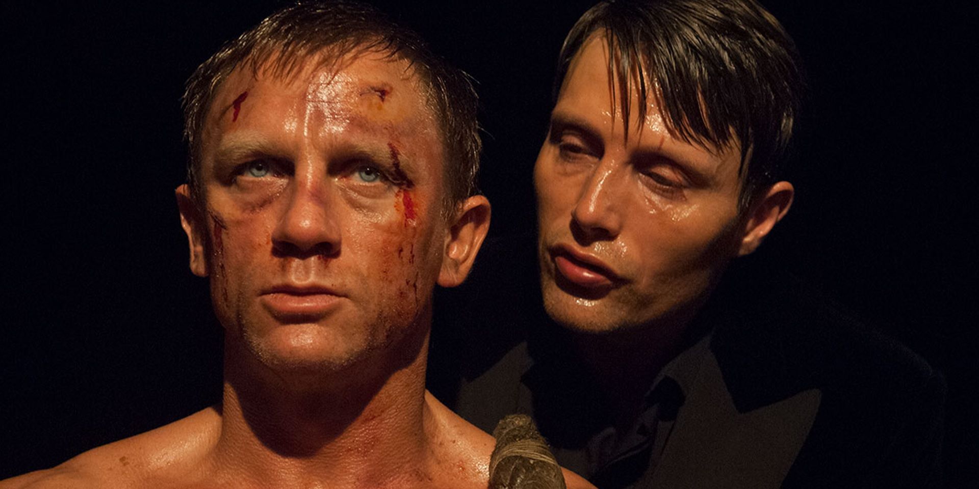 Daniel Craig and Mads Mikkelsen in a dark room in Casino Royale