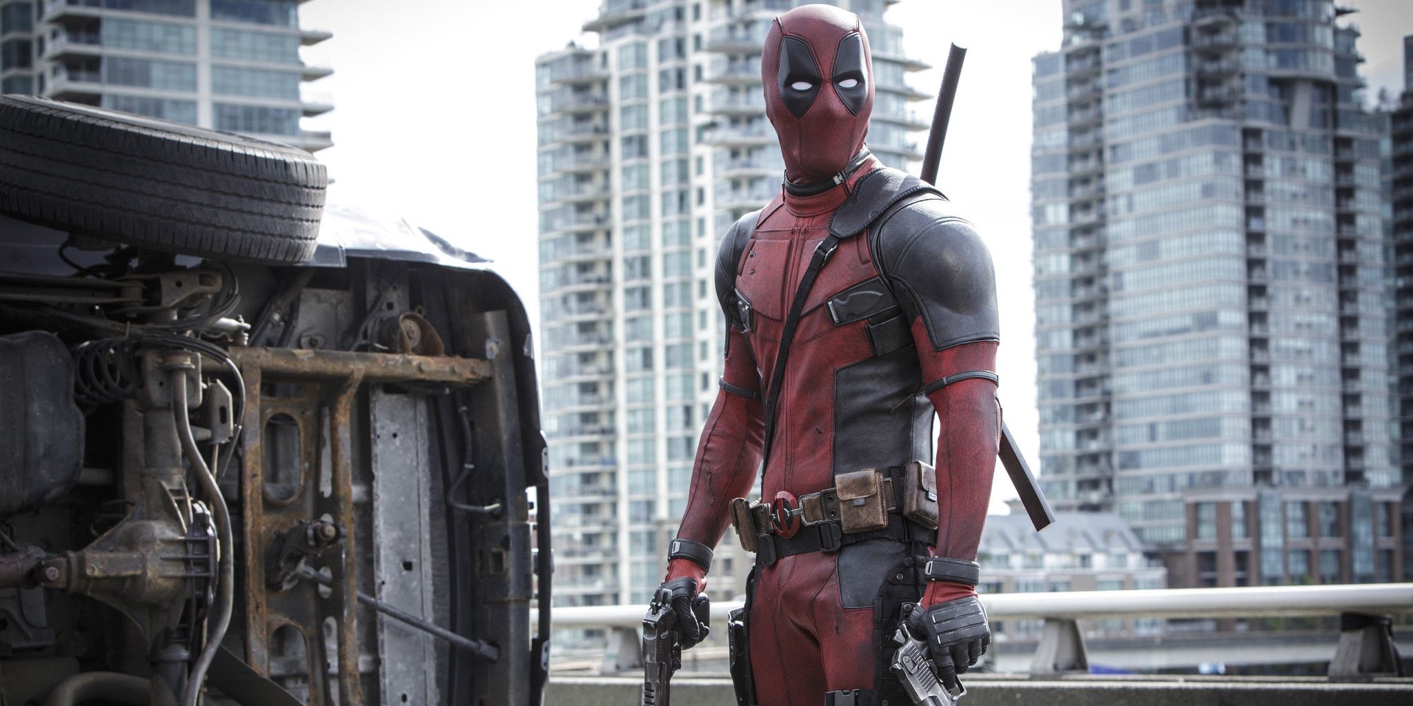 Deadpool with two guns on a highway