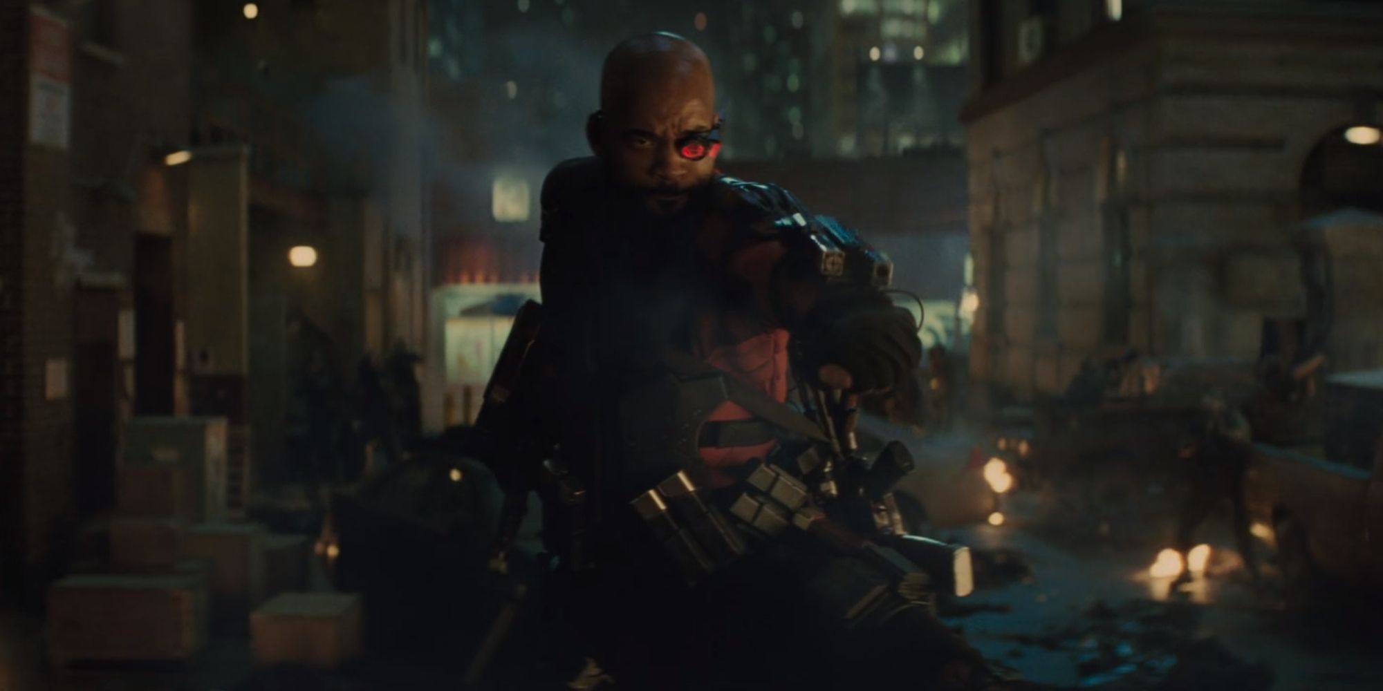 Deadshot on a car fighting zombies with his wrist guns in Suicide Squad (2016).