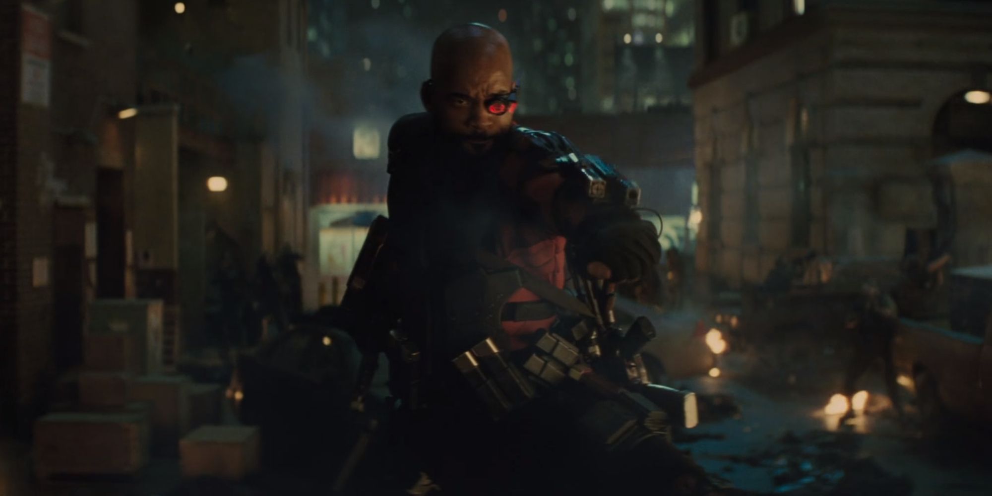 Deadshot on top of a car fighting zombies with his wrist guns in Suicide Squad (2016)