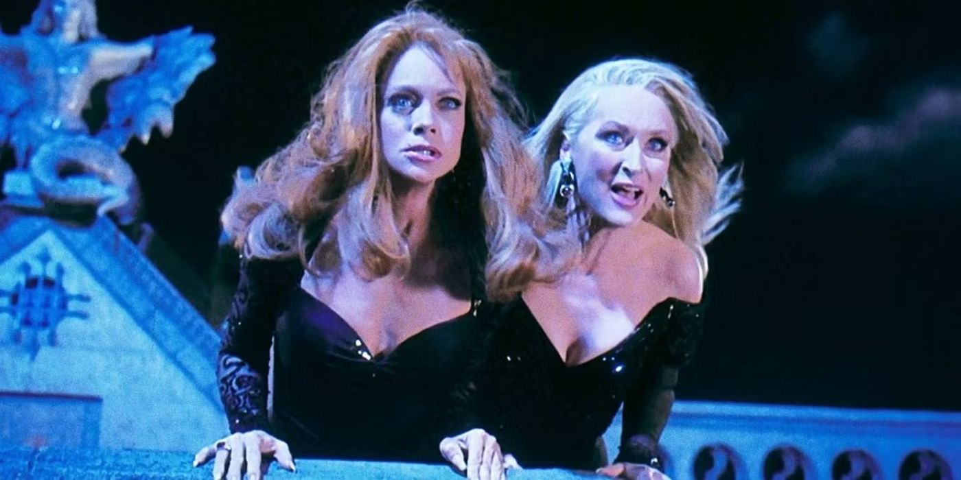 Death Becomes Her Madline and Helen lean over roof
