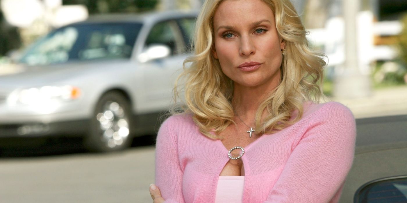 Edie looking serious wearing a pink sweater on Desperate Housewives