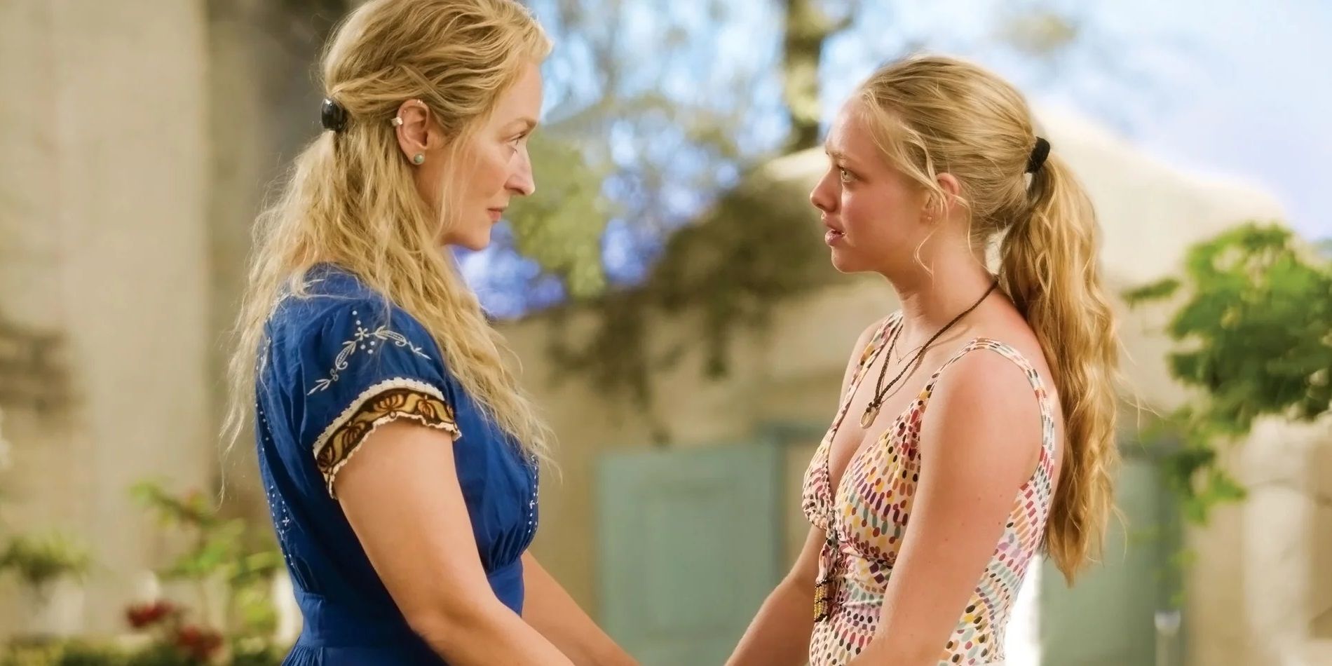 Donna (Meryl Streep) holds Sophie (Amanda Seyfried)'s hands in Mamma Mia!