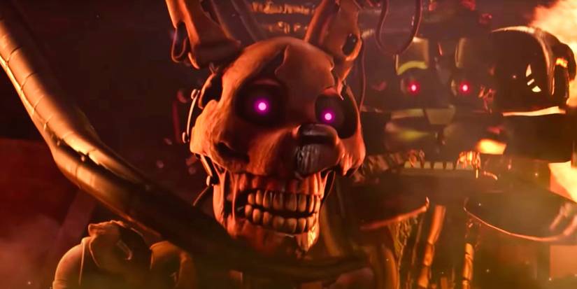 William Afton in his Springtrap suit in the middle of the burning hidden location of the Pizzaplex, with Funtime Freddy's face in the Blob opening right before it grabs him.