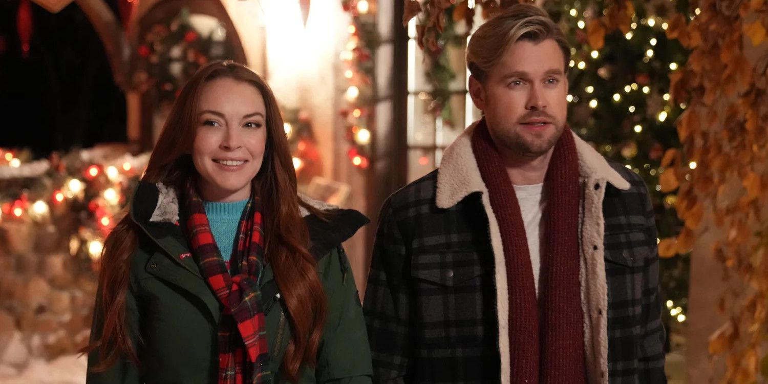 Lindsay Lohan and Chord Overstreet with holiday decorations behind them in the Netflix movie Falling for Christmas
