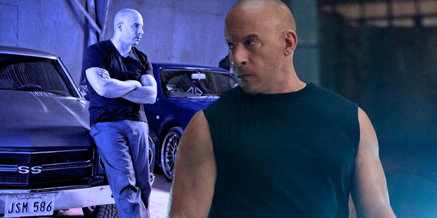 A bald man in a black muscle t-shirt stands in front of a classic car.