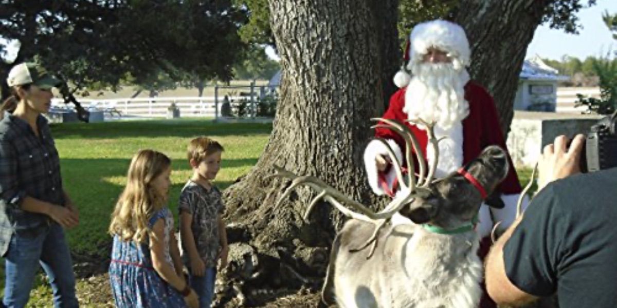 Chip brings reindeer to the yard while dressed as Santa Claus from Fixer Upper