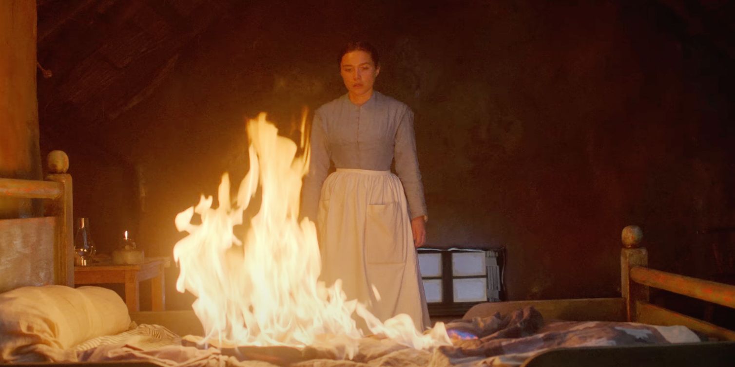 Florence Pugh olhando para uma cama em chamas em The Wonder