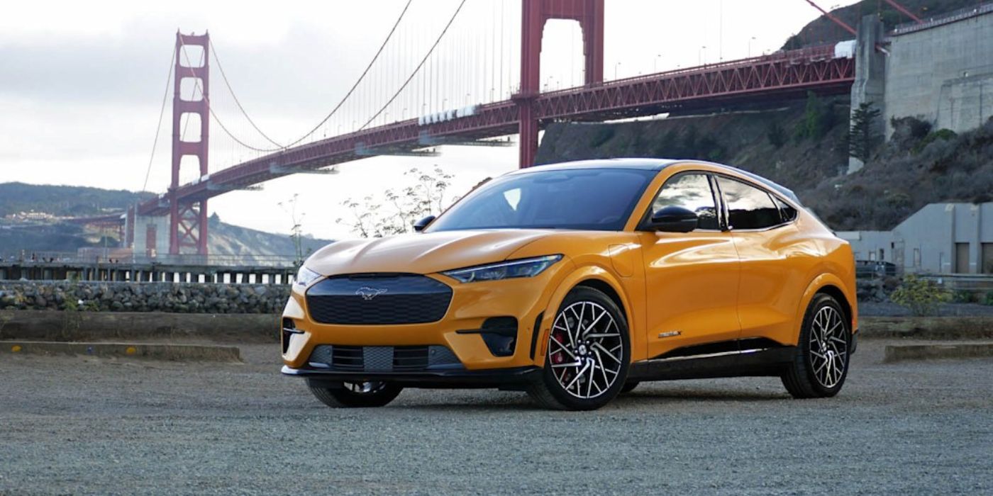 A pared Ford Mustang Mach-E GT with the Golden Gate Bridge on the background.