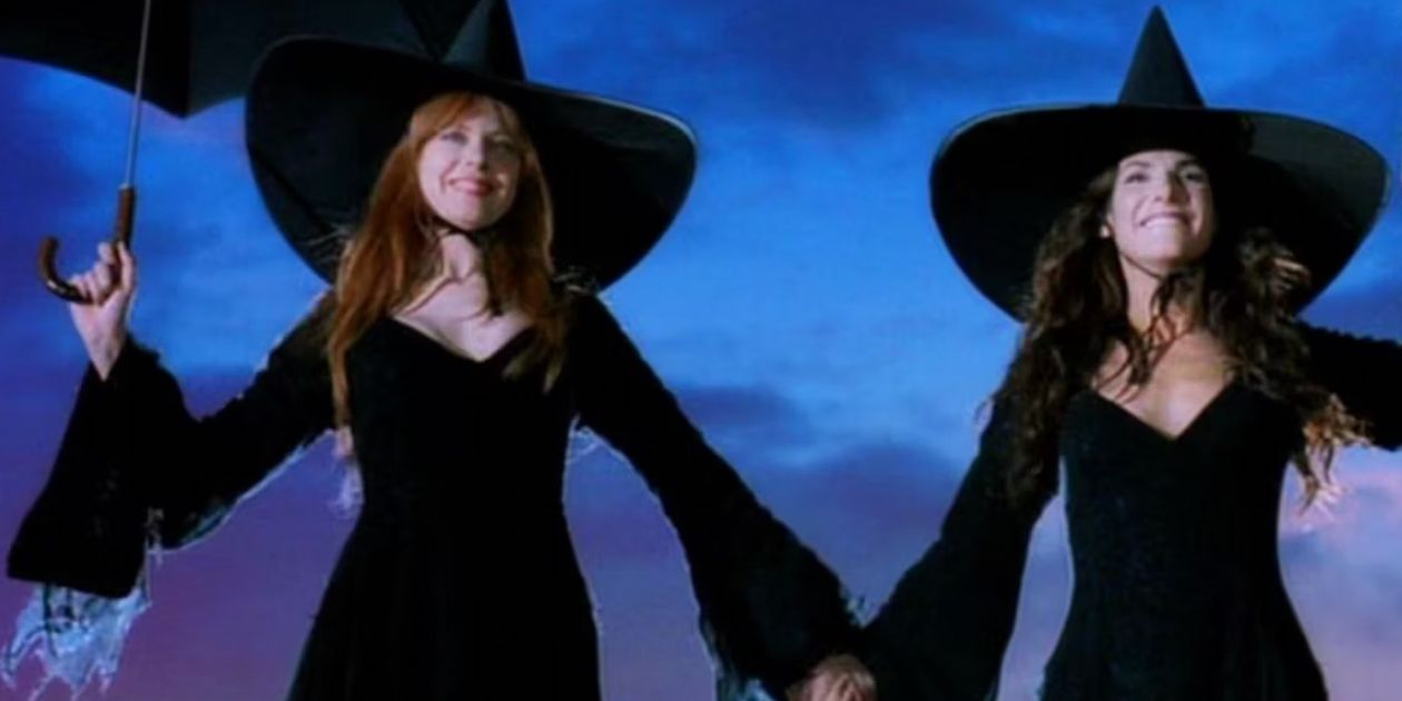 Gilly and Sally in black witch outfits getting ready to jump from the roof in Practical Magic