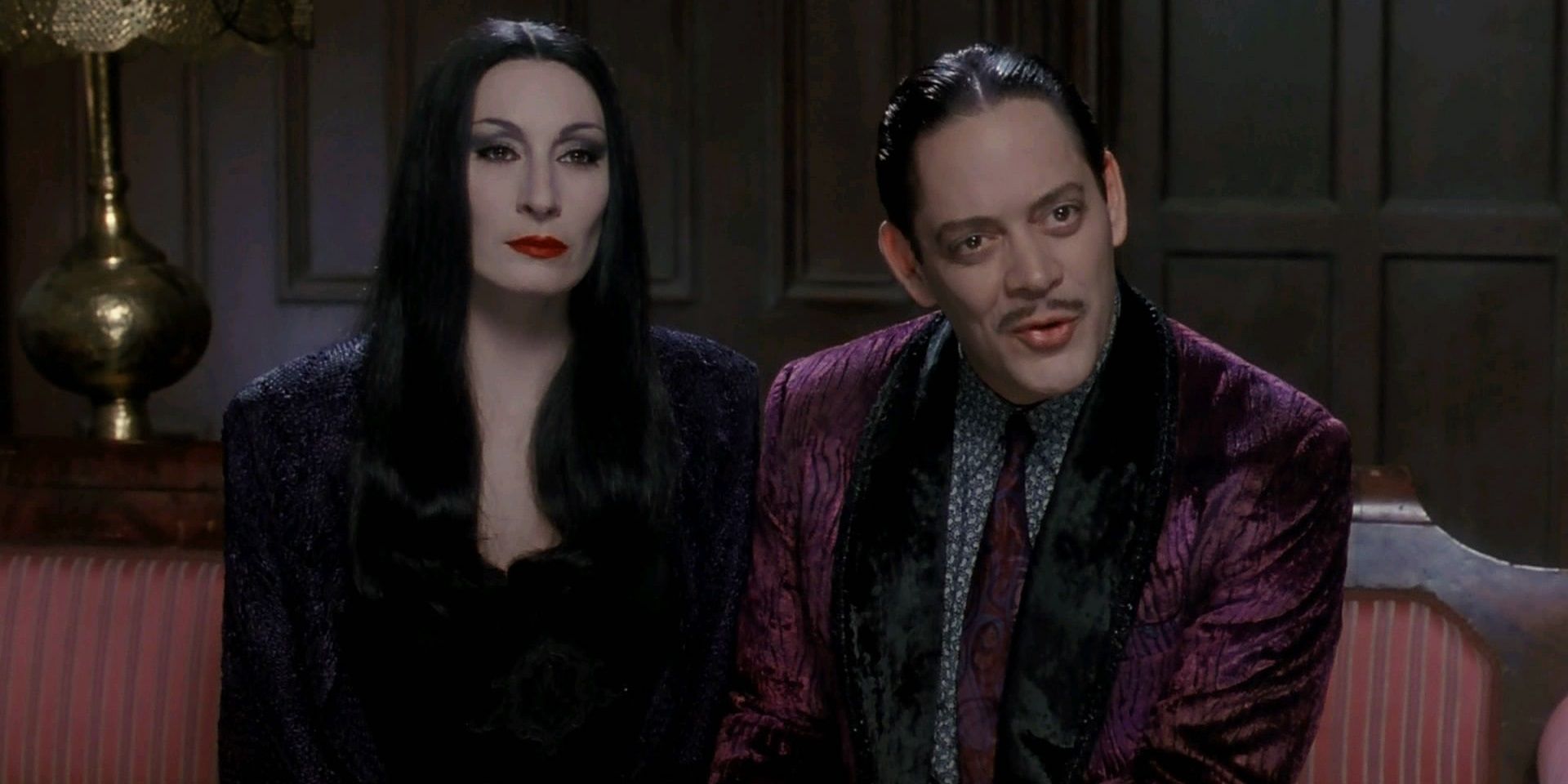 Gomez and Morticia sitting next to each other in The Addams Family