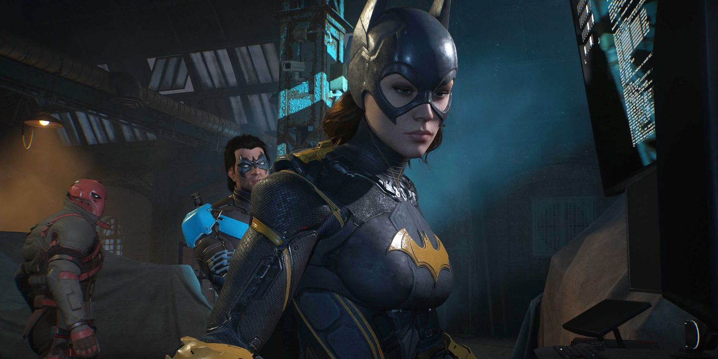 Batgirl at the Batcomputer in Gotham Knights' Belfry with Nightwing and Red Hood in the background.