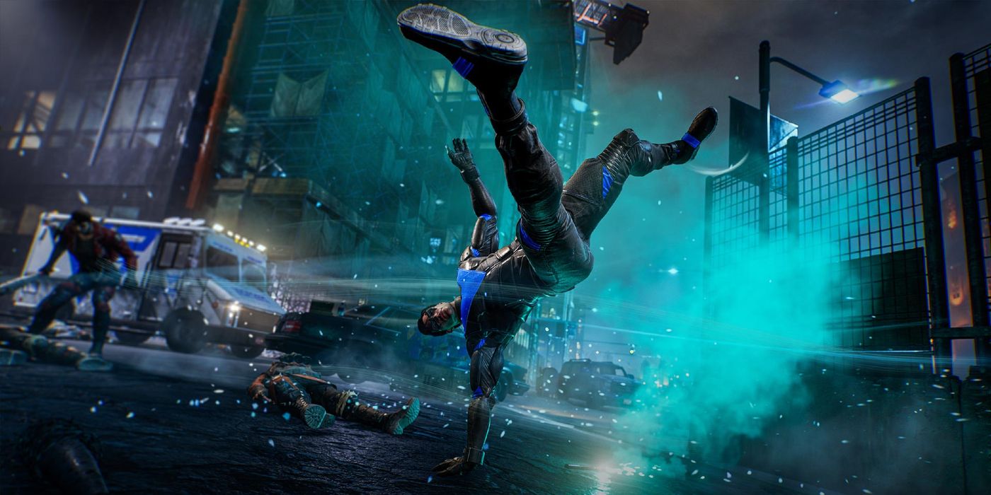 Imagem de Asa Noturna lutando contra um inimigo Freak em Gotham Knights.  Dick Grayson está no nível da rua de Gotham fazendo um ataque giratório com um efeito elemental gelado.