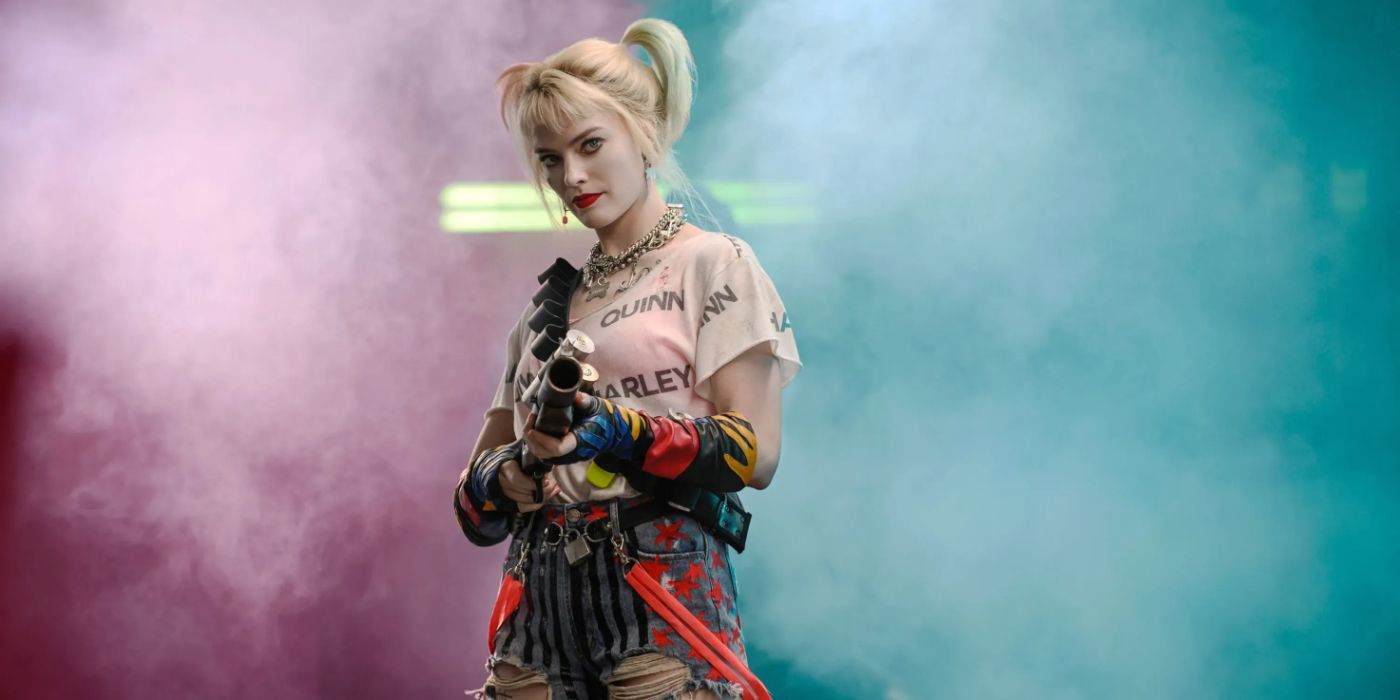 Harley Quinn emerging from the smoke with a gun in Birds of Prey