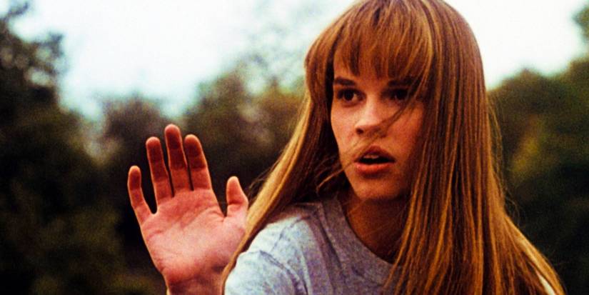 Hilary Swank waving as Julie Pierce in The Next Karate Kid