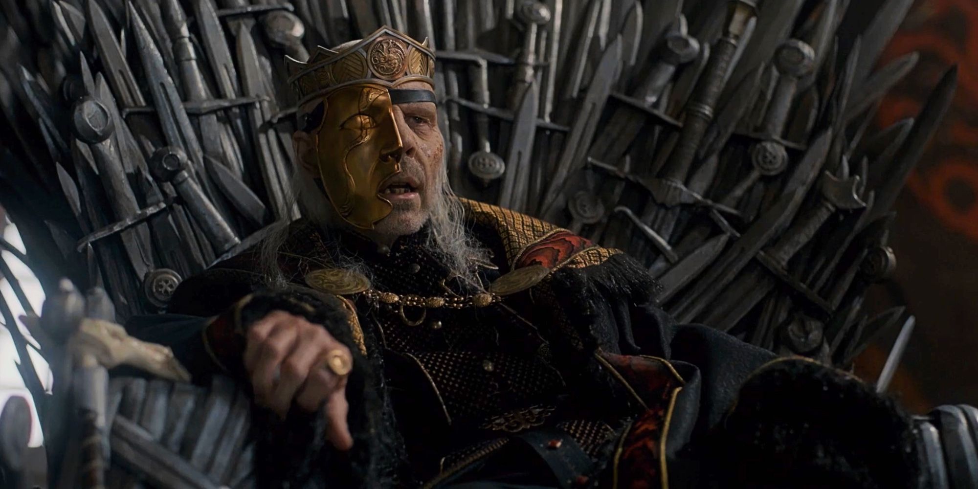 El Rey Viserys Targaryen se sienta en el Trono de Hierro