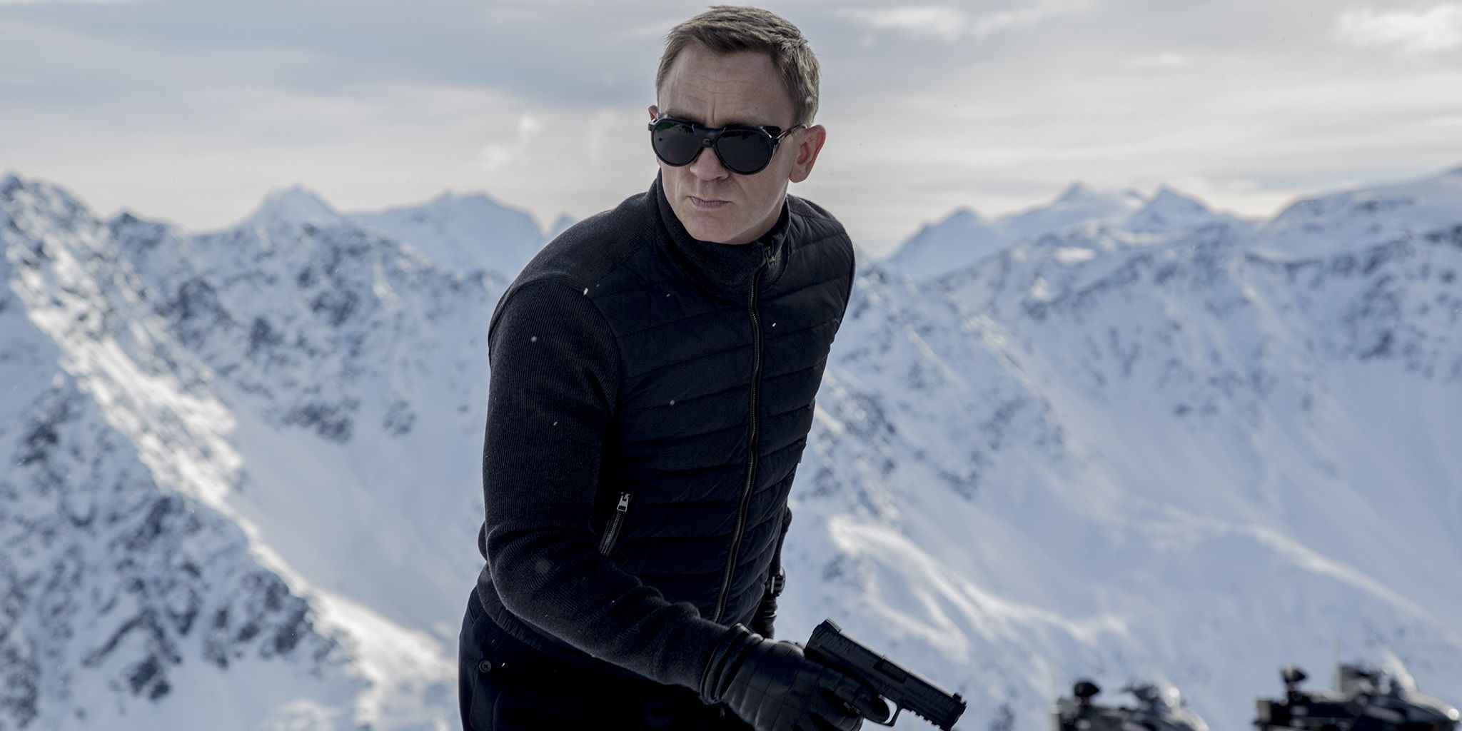 James Bond in the snow with a gun in Spectre