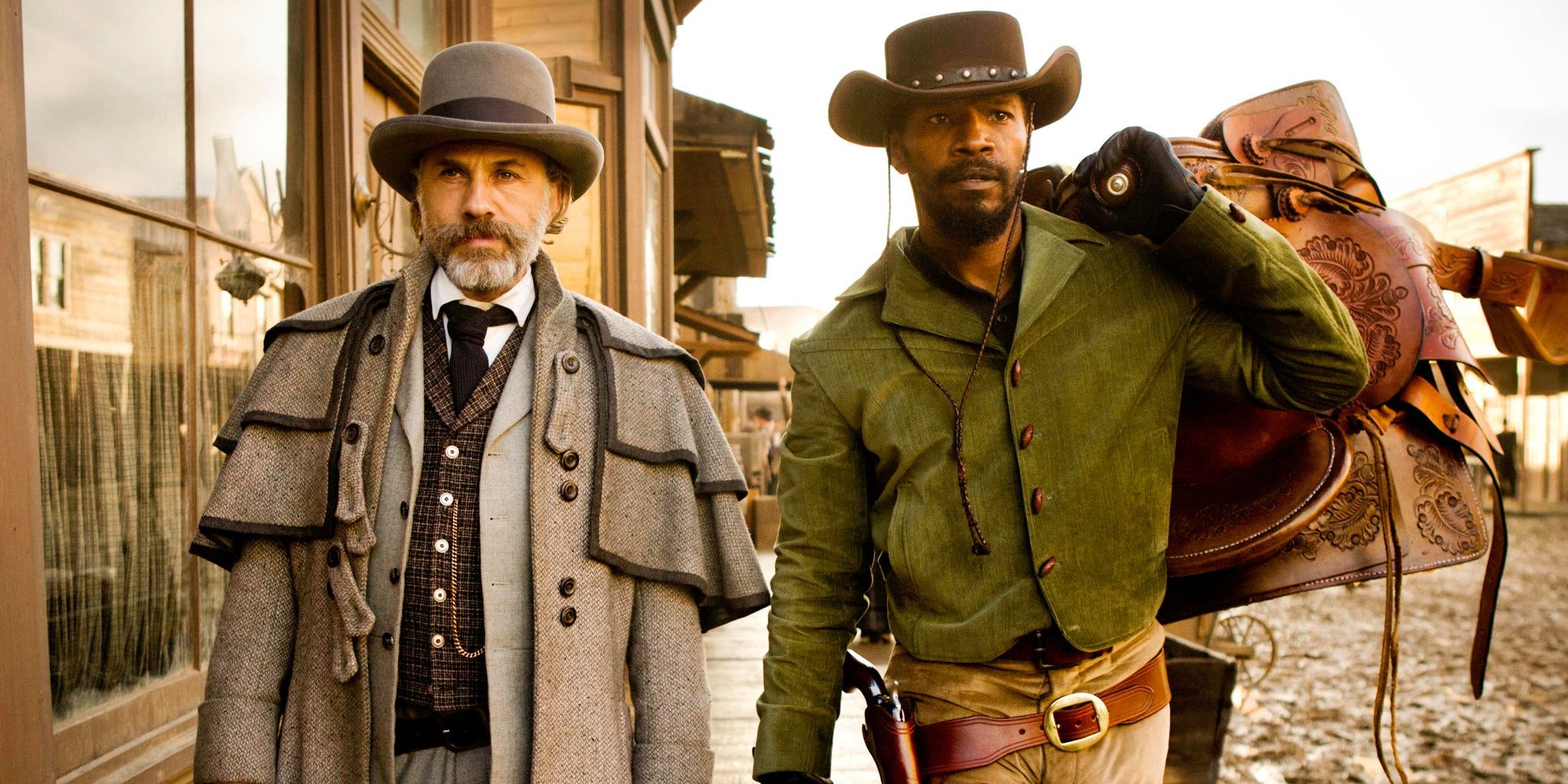 Jamie Foxx and Christoph Waltz walk through a town in Django Unchained