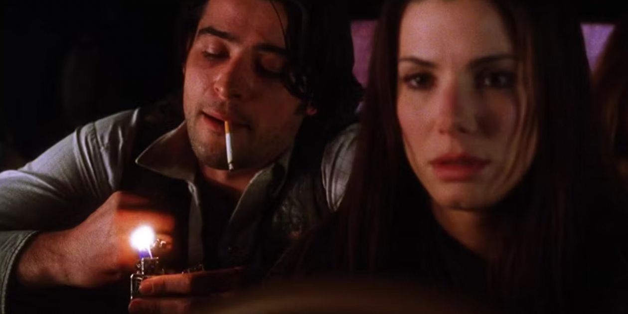 Jimmy with his lighter behind Sally in the car in Practical Magic