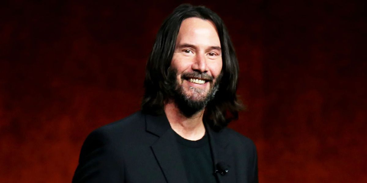 An image of a smiling Keanu Reeves is shown.