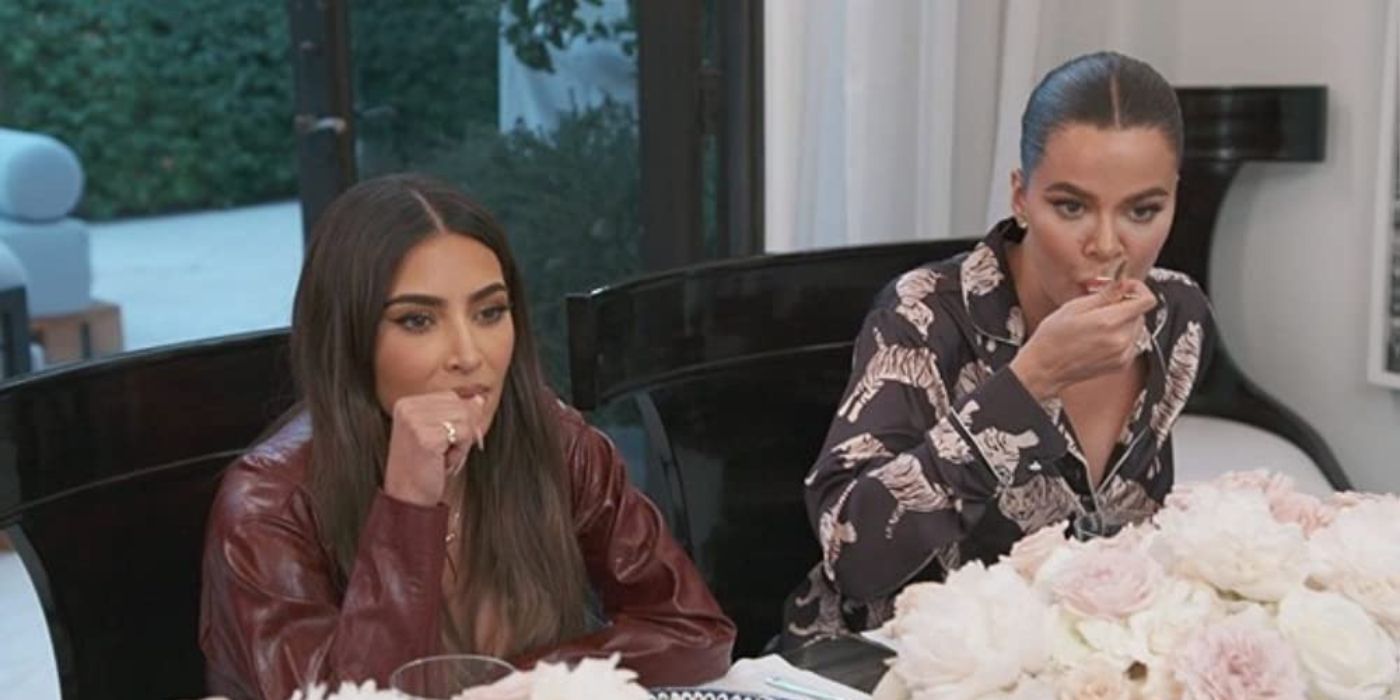 Kim and Khloe eating at the table on KUWTK