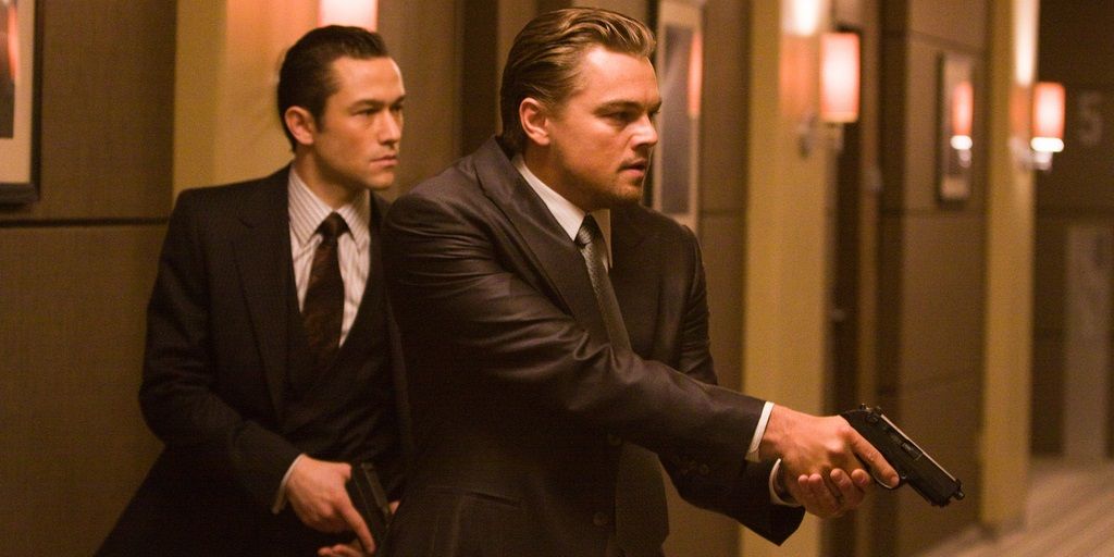 Leonardo DiCaprio and Joseph Gordon-Levitt with guns in Inception
