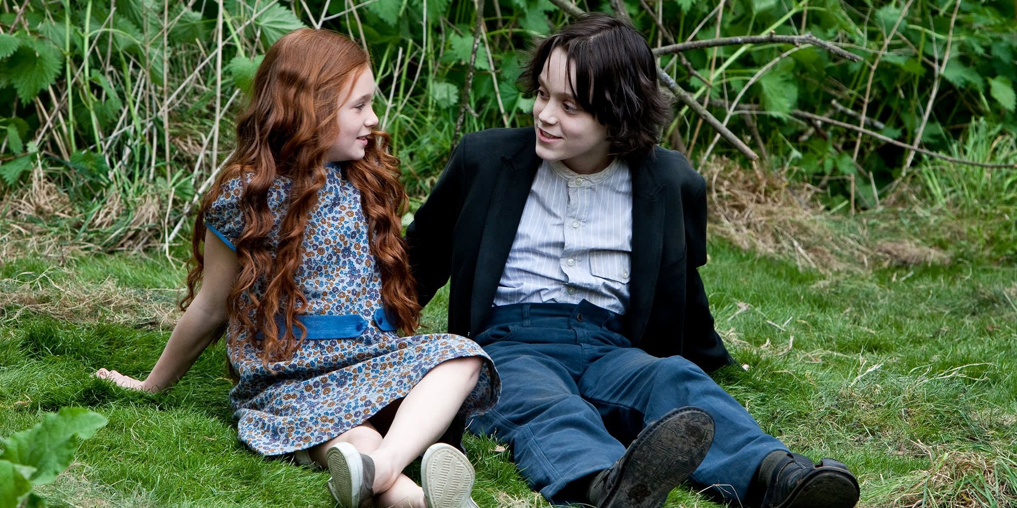 Lily and Severus sit on the grass in Harry Potter 8 