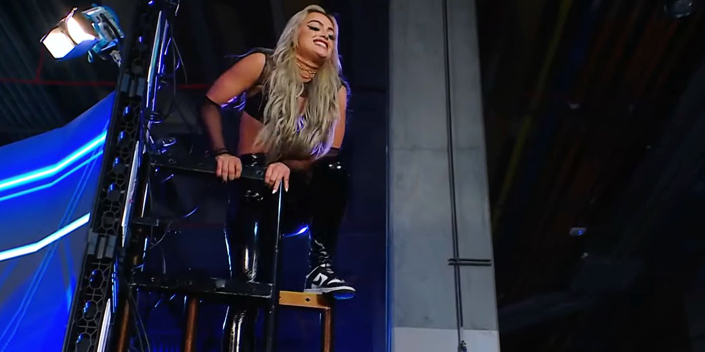 Liv Morgan prepares to leap off of a scaffolding onto Sonya Deville during WWE SmackDown.