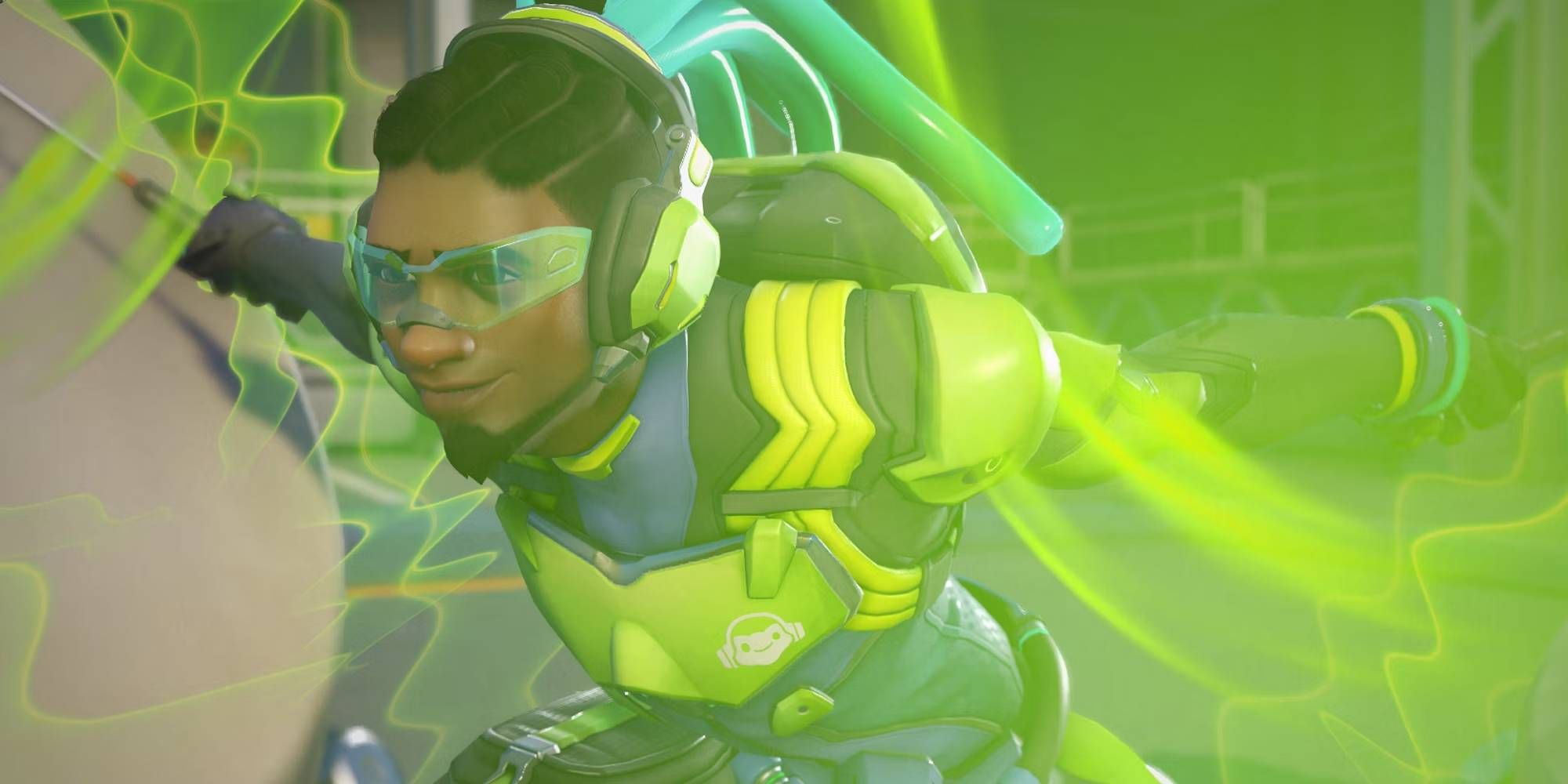 Overwatch 2 Lucio Using Sound Barrier Ultimate Ability Awash in Green Glow While Smiling