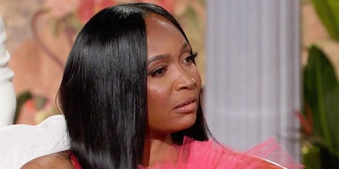 Marlo listening to Andy at the season 14 of RHOA reunion