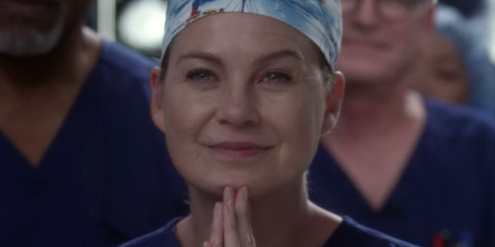 Meredith smiles with her hands closed together in Grey&rsquo;s Anatomy
