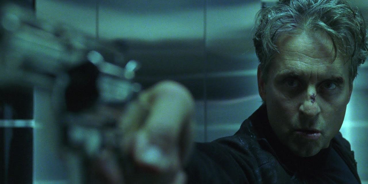Michael Douglas points a gun in The Game
