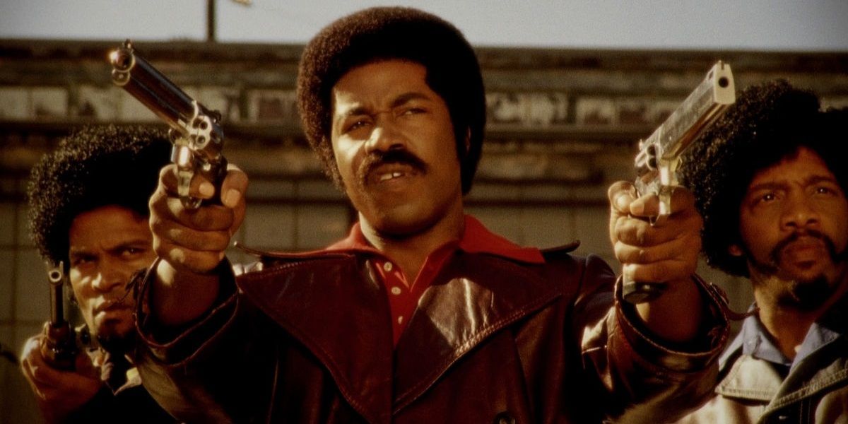 Michael Jai White with two guns in Black Dynamite