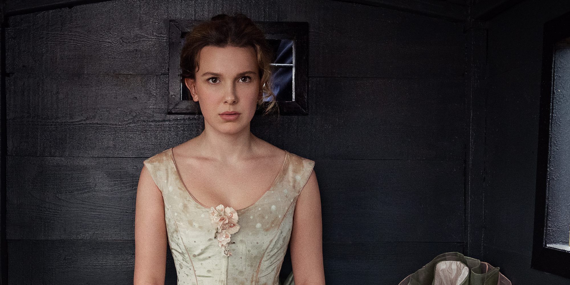 Millie Bobby Brown as Enola Holmes sits in a carriage in Enola Holmes 2