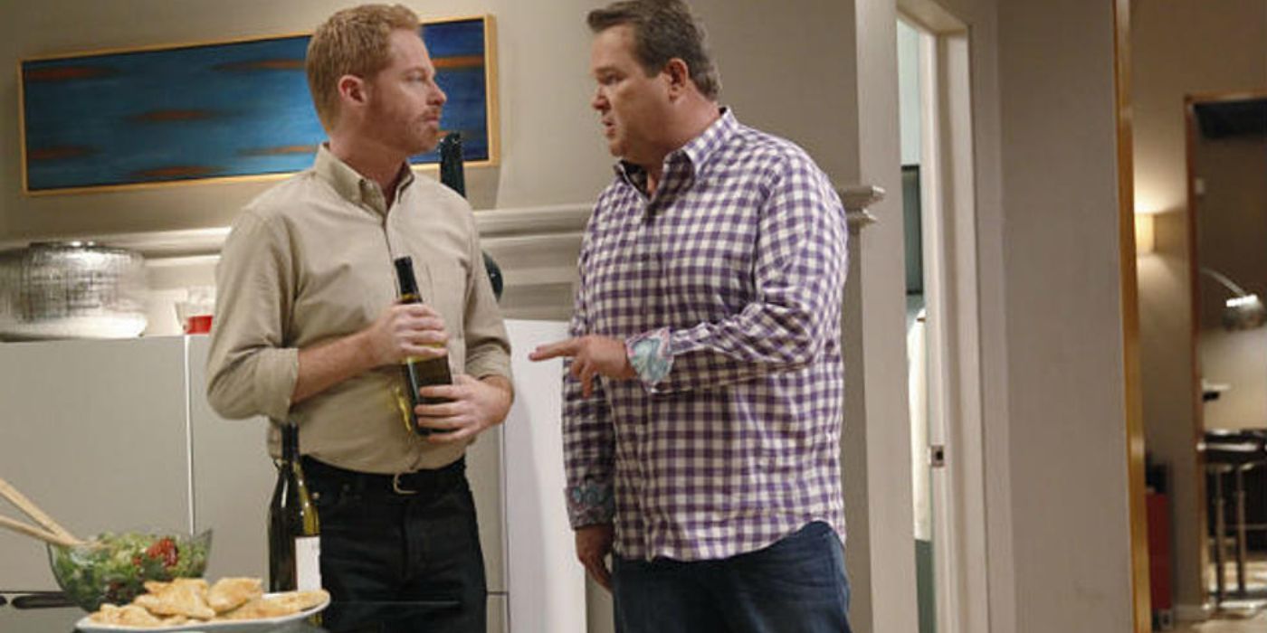 Mitch and Cam talk over wine on Modern Family