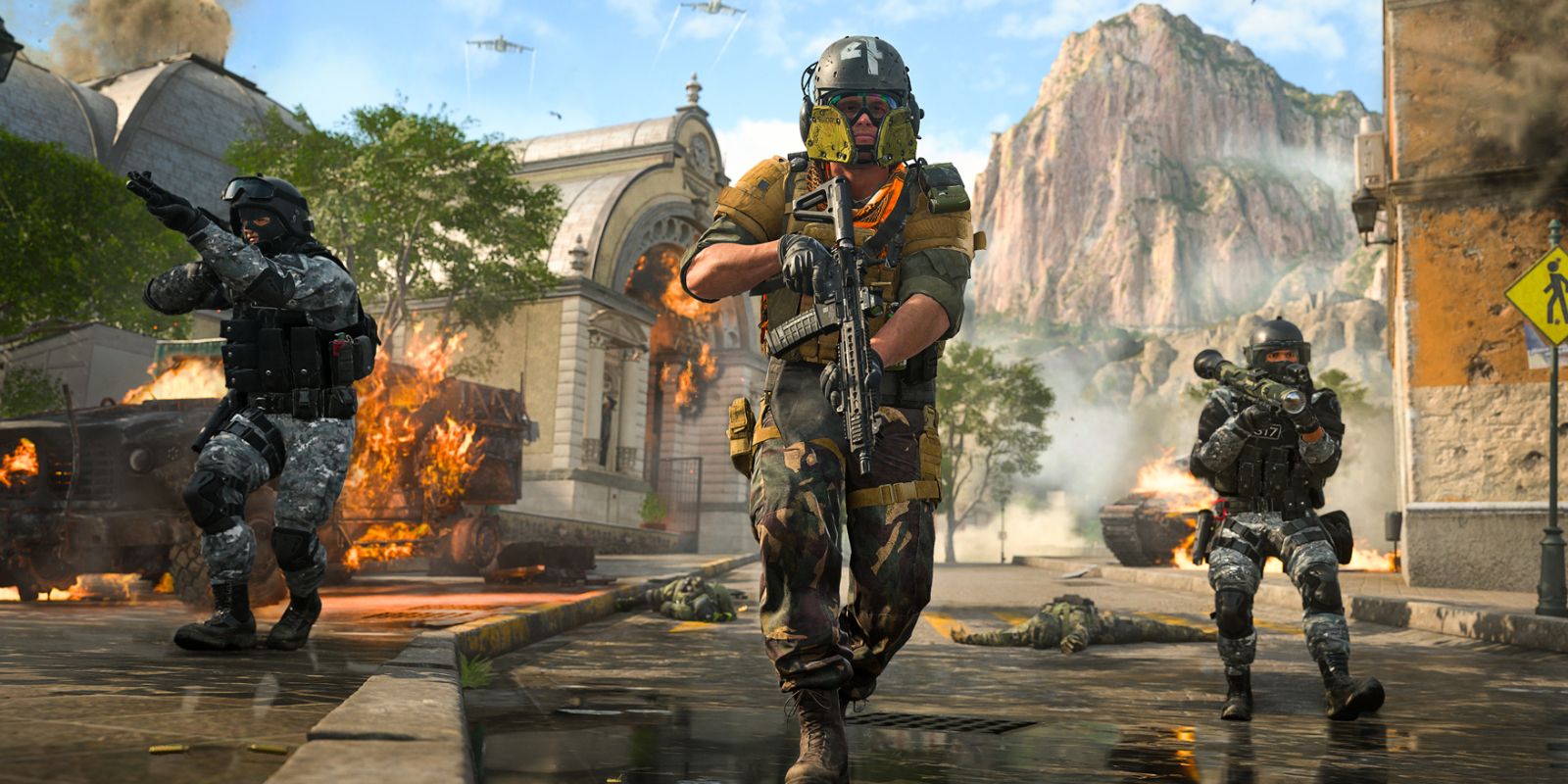 Three teammates in Call of Duty: Modern Warfare 2, weapons drawn.