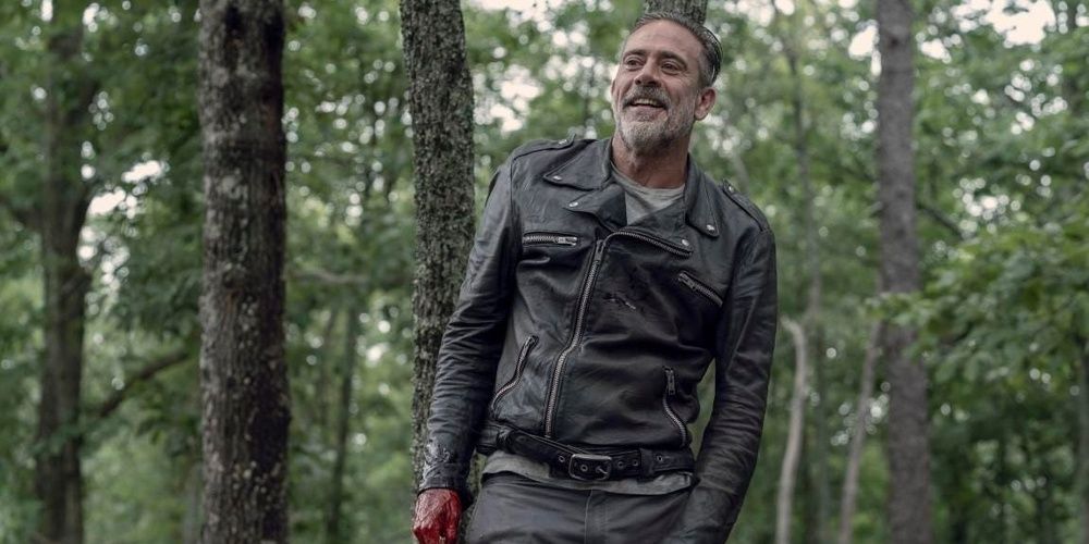 Negan laughs in the woods in The Walking Dead