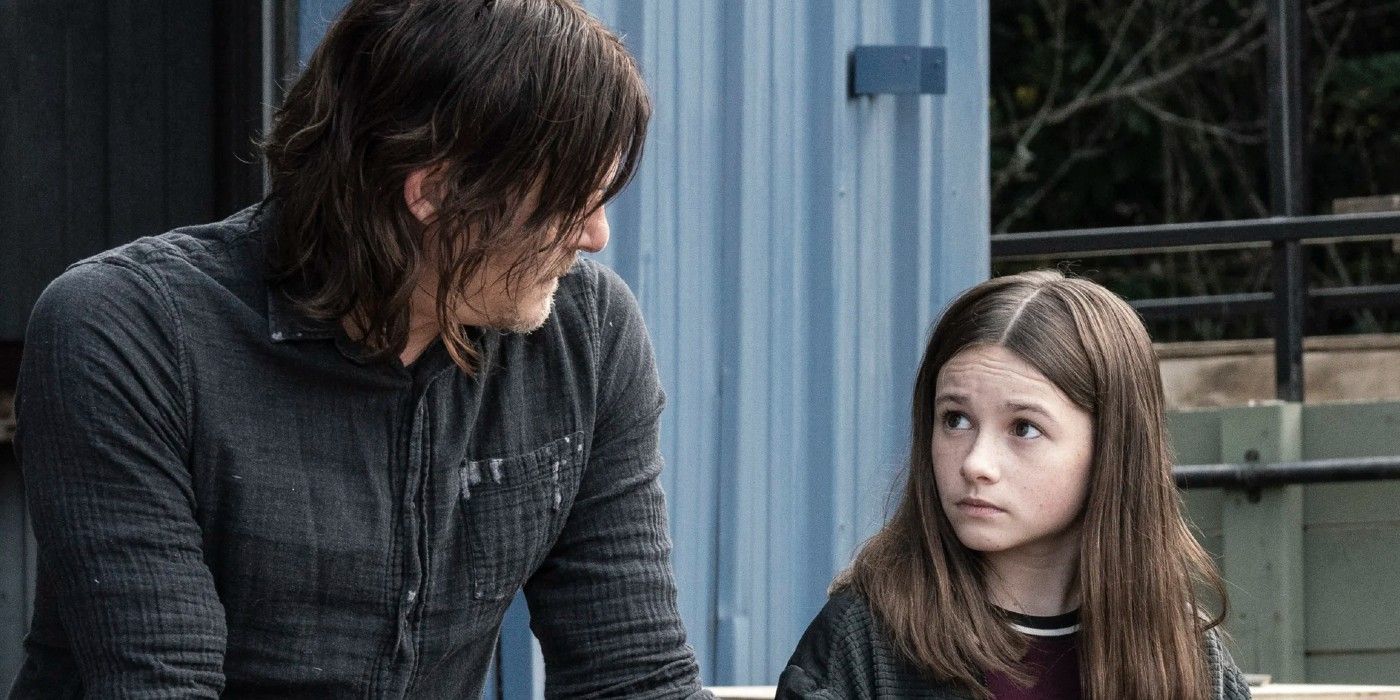 Norman Reedus as Daryl and Cailey Fleming as Judith talking in Walking Dead