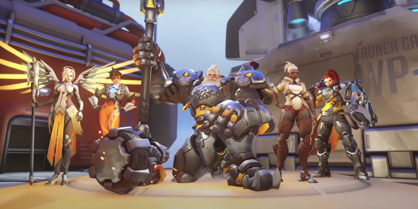 Team in Overwatch 2 in their various victory poses. Mercy, Tracer, Reinhardt, Sojourn and Brigitte are present on the game's Gibraltar map.
